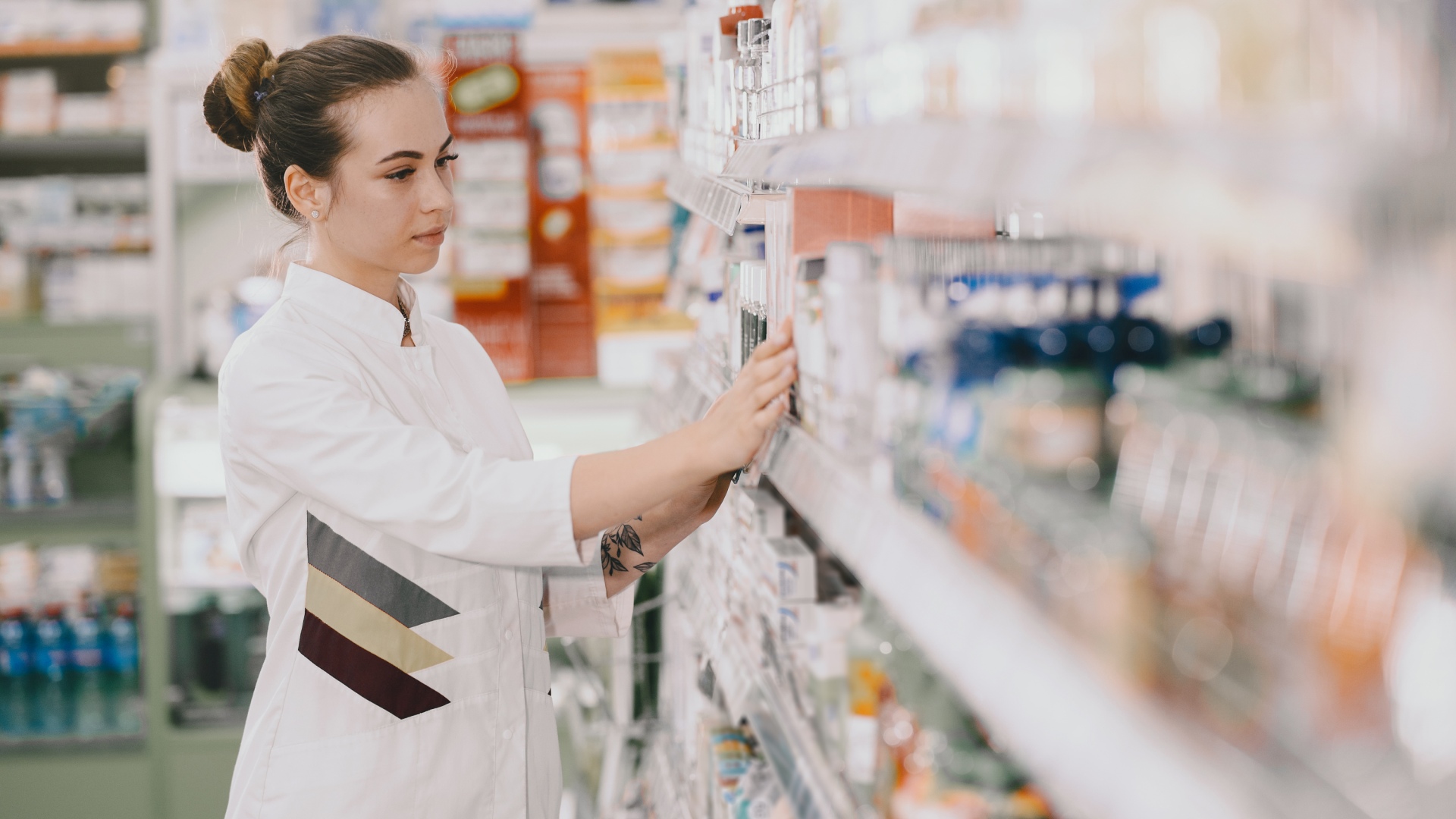 Woman pharmacist checking medicine in pharmacy